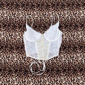 coquette lace corset with pink rosettes